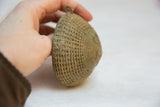 Vintage African bronze hanging with textured mesh pattern and aged patina.