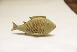 Oxidized bronze fish sculpture showing its textured mesh pattern and aged patina.