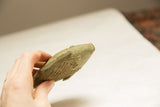 Close-up of the vintage bronze fish's head, showing the detailed mesh texture and oxidized green surface.