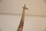 Textured patina and sculpted details on the vintage bronze giraffe's head and neck.