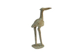 A large vintage African bronze stork sculpture with a mottled, oxidized green patina.