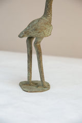 Hand-textured legs and solid base of the vintage oxidized bronze stork figure.