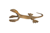 Vintage handmade African gecko sculpture with a matte bronze and gold patina.