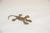 Detailed view of the vintage bronze gecko's expressive face and textured finish.