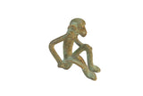 Vintage handmade African bronze sitting monkey sculpture with green patina.