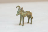Side view of a vintage African bronze ram showing its textured, aged patina.