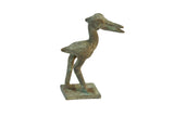 Vintage African oxidized bronze stork standing on a square base with a textured, green patina.