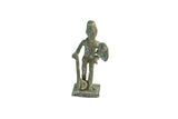 Small vintage African warrior figurine with a weathered, oxidized green patina.