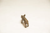 Textured back and legs of a vintage African bronze pig.