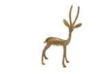 Vintage handmade African gazelle sculpture with a light patina and elegant, turning pose.