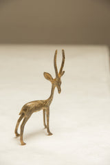 Profile of a vintage African gazelle showing its slender form and textured light patina.