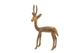 Vintage African metal gazelle sculpture with a textured golden patina finish.