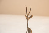 Close-up view of the handmade details on a vintage gazelle's head and slender antlers.