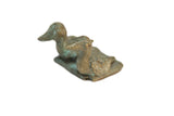 Vintage African bronze sitting birds with a weathered, handmade texture and green patina.