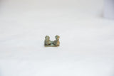 Front view of the vintage African bronze bird pair, highlighting their rustic, handmade texture.