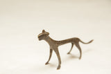 Angled view of the vintage African bronze cheetah, highlighting its dark patina and spotted texture.