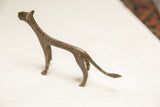 Textured tail and hind leg of the vintage African dark bronze cheetah sculpture.