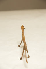 Slender vintage African bronze cheetah sculpture with rustic light patina.
