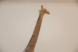 Textured bronze head and upper neck of the vintage giraffe sculpture, showing light patina.