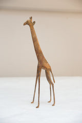 Slender legs and torso of the vintage African bronze giraffe with light patina.