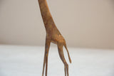 Vintage African handmade bronze giraffe's detailed body and legs with light patina.