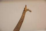 Vintage African bronze giraffe neck showing light patina and intricate etched details.