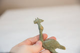 Close view of the vintage African stork's head highlighting its handmade oxidized texture.