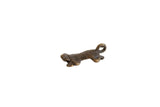 Vintage dark bronze turtle hatchling pendant with a textured body and looped tail.