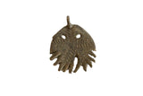Vintage African jellyfish pendant made of oxidized bronze with a rustic, handmade texture.