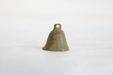 Handmade African bronze bell showcasing its rich, aged patina and texture.