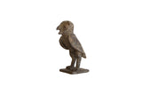 Vintage African bronze owl, handmade collectible with aged texture, side view.