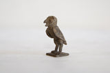 Collectible handmade African bronze owl, side view showcasing aged patina.