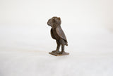 Vintage African bronze owl statue, showing textured dark bronze with aged patina.
