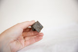 Textured square bronze base with aged patina on the vintage African owl sculpture.