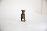 Rear view of a vintage African bronze owl, featuring handmade details and rustic patina.