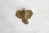 Vintage African bronze elephant pendant with unique handmade character and light patina.