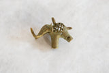 Side profile of the oxidized bronze elephant pendant highlighting its caged mesh body.