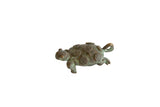 Vintage African bronze turtle pendant with an oxidized green patina and spiral-patterned shell.