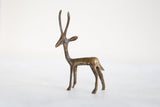 Three-quarter view of the vintage bronze gazelle showing its slender form and handmade texture.