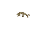 Vintage African pangolin pendant with a textured, oxidized bronze finish and green patina.