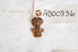 Hand-carved lower section of the vintage African wooden person pendant with aged texture.