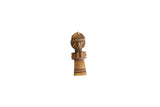 Vintage African wooden person pendant, a hand-carved collectible with stylized features.