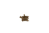 Vintage African bronze turtle pendant facing right with a hollow, mesh-patterned shell.