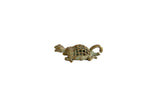 Vintage African oxidized bronze turtle pendant with a handmade mesh design shell.