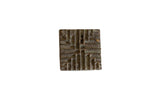 Vintage African square bronze coin with textured, raised geometric pattern and dark patina, 2x2 inches.