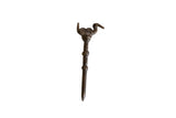 Vintage African handmade bronze bird pin with a stylized form and aged patina.