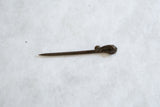 Side profile of the vintage handmade bronze chameleon pin showing its full length.