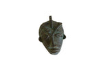 Large vintage African bronze mask pendant with aged green patina and braided head details.