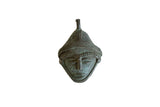 Vintage African mask pendant in dark oxidized bronze with serene features and a textured headdress.