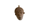 Vintage African bronze mask pendant with handmade details and a warm, aged patina.